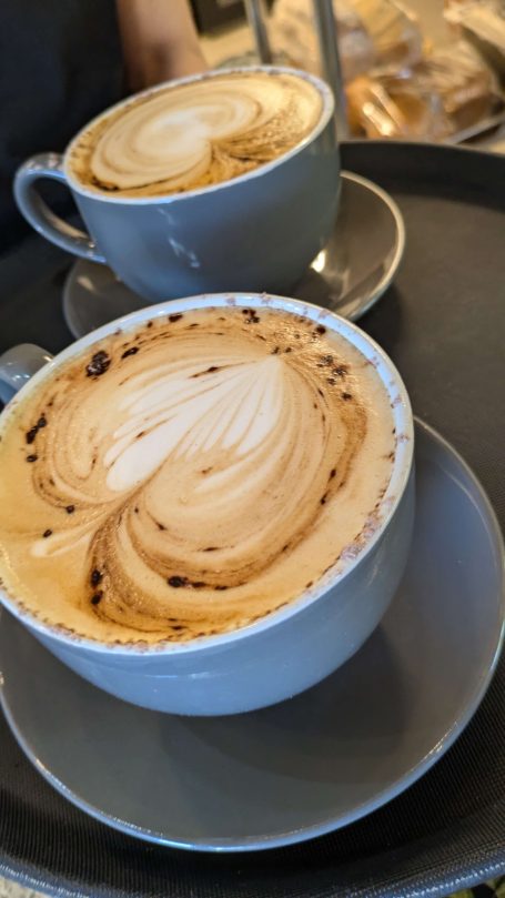 Two lattes with latte art at the Chestnut Cafe, Sorrel Horse, Shottisham in Suffolk