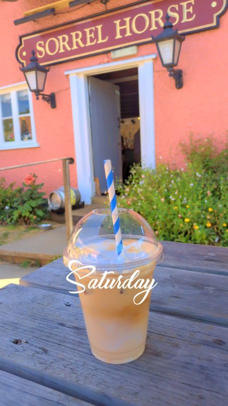 Iced Latte with background of The Sorrel Horse Inn, Shottisham, Suffolk