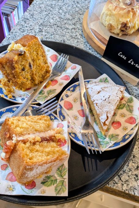 Two slices of cakes on plates at the Chestnut Cafe, Sorrel Horse, Shottisham in Suffolk